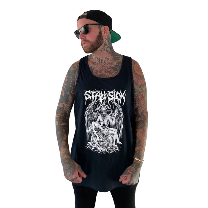A tattooed man in sunglasses and a backward cap wears a Stay Sick Clothing Baphomet Tank Top with a gothic, illustrated demon-embracing-woman design and stylized text, standing against a plain white background.