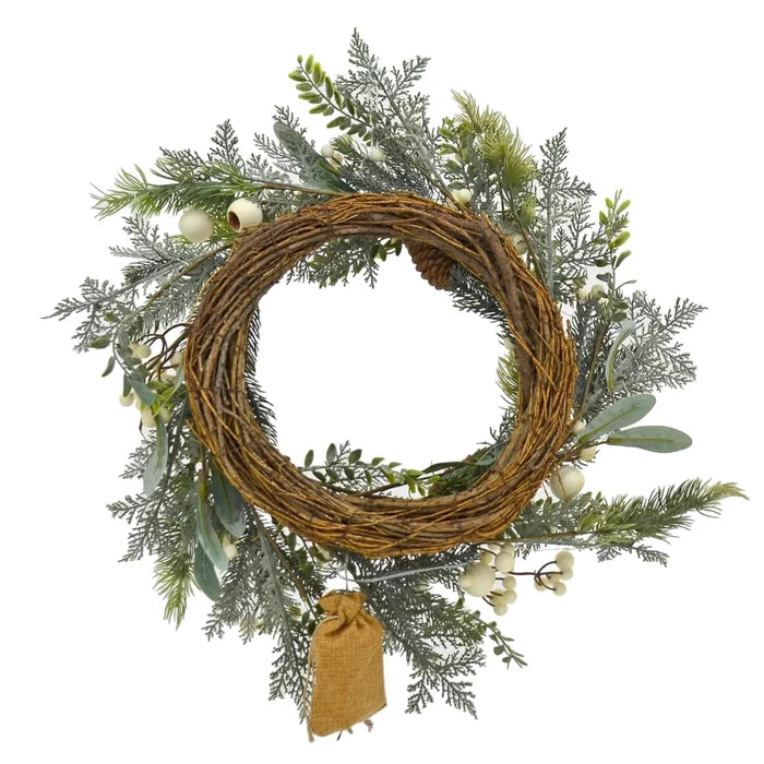 Back view of a Christmas wreath with brown rattan weave base, green foliage and white snowberries