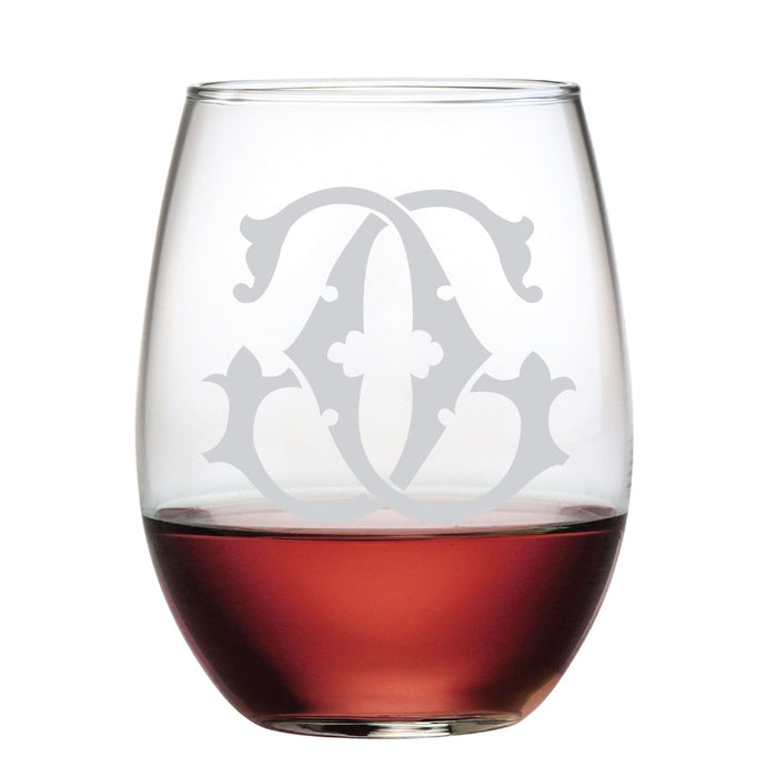 The 1-Letter Etched Initial Stemless Wine Glass, featuring an elegant frosted monogram with stylized letters and decorative swirls, adds a sophisticated touch to any occasion and makes for an ideal gift.
