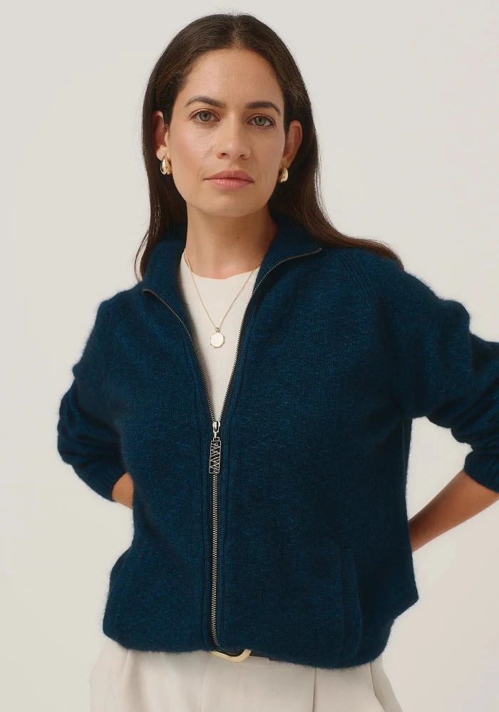 Possum and Merino

100300 Arianne Jacket - The Arianne is that everyday jacket you'll reach for all the time. Paired with jeans or chinos, it has a smart casual look and an interesting textural knit. Topped off with pockets and a stylish Merinomink zip pull, it's designed to keep you warm without weighing you down. Classic fit.&nbsp;

Made in New Zealand from an exclusive Merinomink blend of 50% ZQ Merino, 40% Brushtail possum and 10% Mulberry silk.