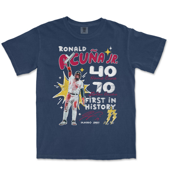 Comfort Colors navy T-shirt featuring a graphic of Ronald Acuña Jr. celebrating with text highlighting his 40 home runs, 70 stolen bases, and historic first in baseball.