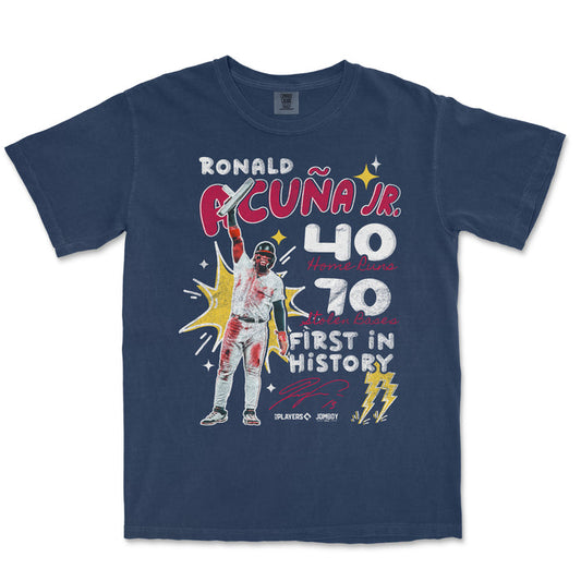 Comfort Colors navy T-shirt featuring a graphic of Ronald Acuña Jr. celebrating with text highlighting his 40 home runs, 70 stolen bases, and historic first in baseball.