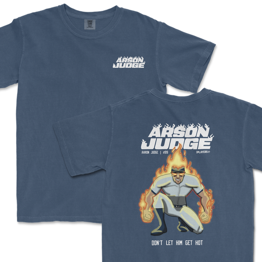 Blue t-shirt featuring a graphic of a superhero-like character on fire with "Arson Judge" text on the back.