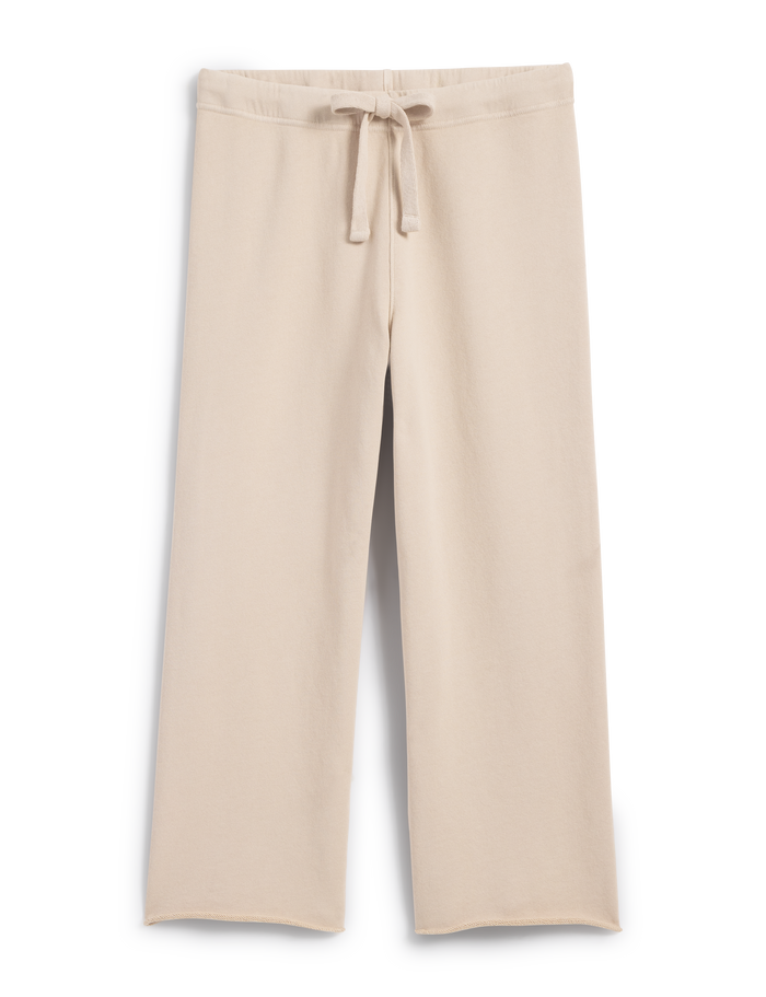 A pair of beige, wide-legged, cropped sweatpants with a drawstring waist.