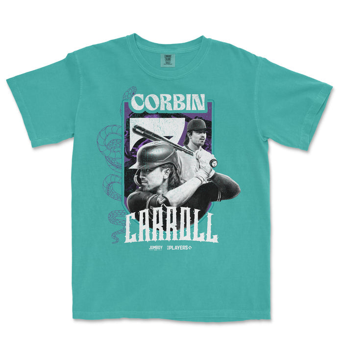 A teal T-shirt featuring a graphic of Corbin Carroll, a baseball player, with a snake illustration and bold text design.