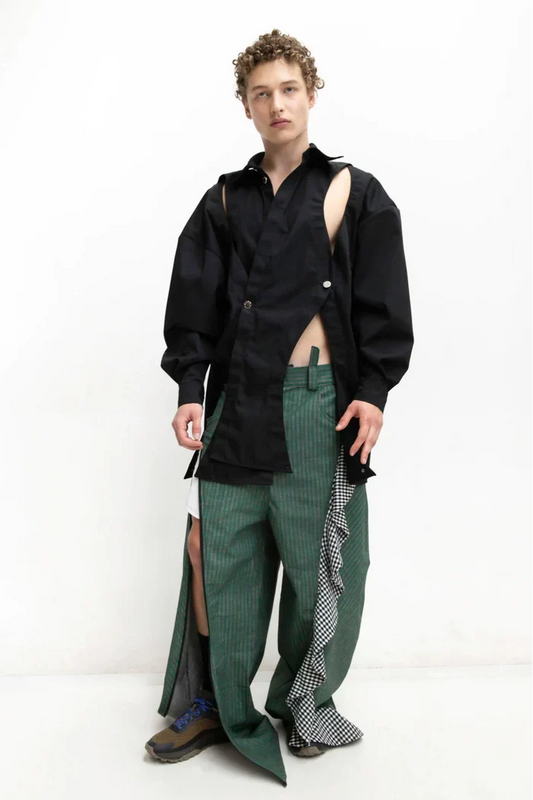 MANCANDY Crossed Garment Jacket featuring curved overlapping panels, exposed nickel buttons, shirt collar and water-repellent cotton-nylon construction.