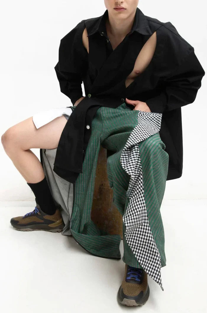 MANCANDY Crossed Garment Jacket featuring curved overlapping panels, exposed nickel buttons, shirt collar and water-repellent cotton-nylon construction.