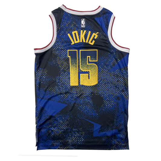 Back View of jersey, showing "JOKI?" and the number "15" in yellow lettering. The jersey features a blue and black patterned design.
