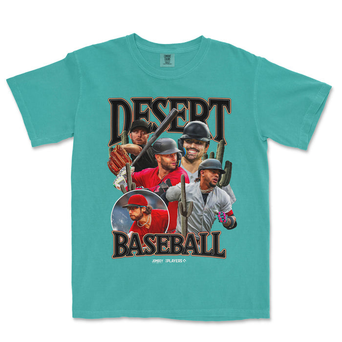 Turquoise Comfort Colors tee featuring a desert baseball graphic with five players, cacti, and bold "Desert Baseball" text.
