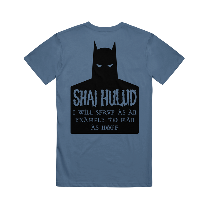 A blue Comfort Colors T-shirt by Shai Hulud features a black Batman silhouette, with “SHAI HULUD” and “I will serve as an example to man as hope” in stylized font on the back—a bold addition to your printed collection.