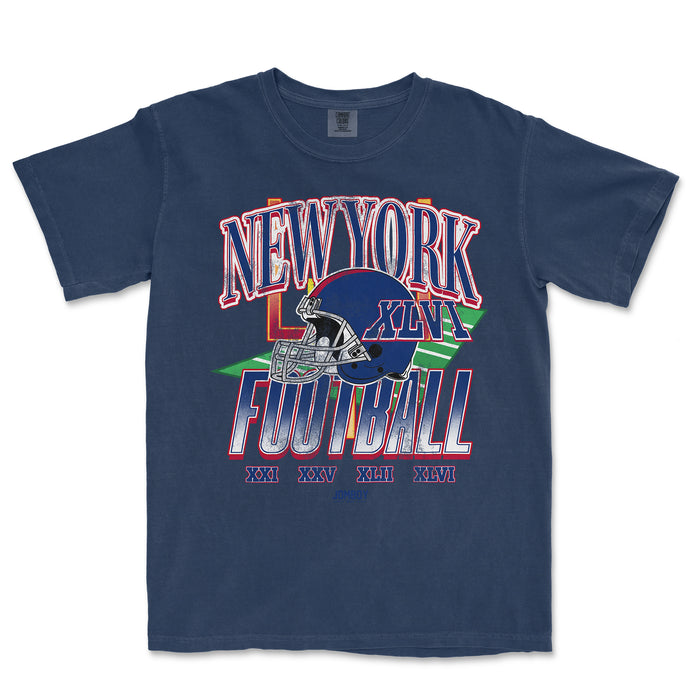 Vintage navy Comfort Colors T-shirt featuring a colorful New York Giants football graphic with Roman numerals and a helmet design.