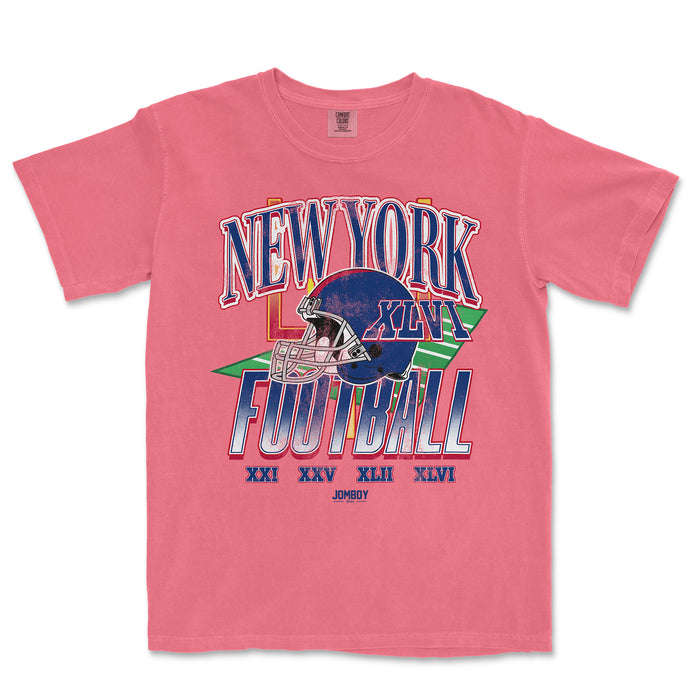 Pink vintage Comfort Colors® T-shirt featuring a colorful graphic design of a football helmet, "New York Football" text, and Roman numerals.