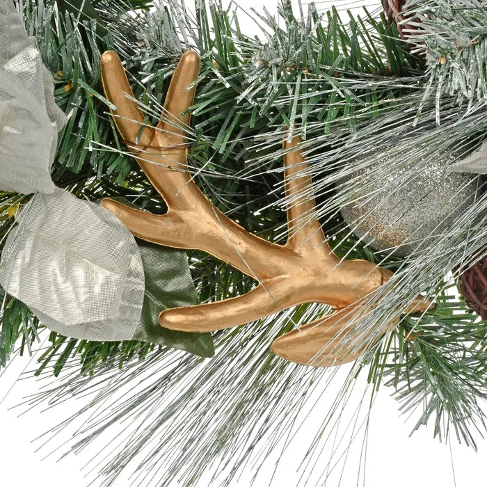 Gold reindeer antler and silver glitter bauble on a Christmas wreath