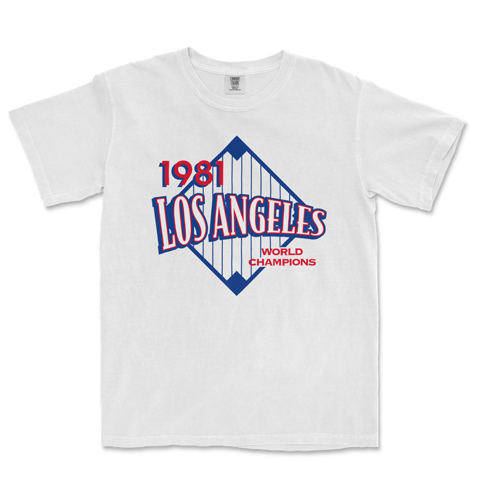 White Comfort Colors tee featuring a vintage Los Angeles 1981 World Champions graphic with red, blue, and white design elements.