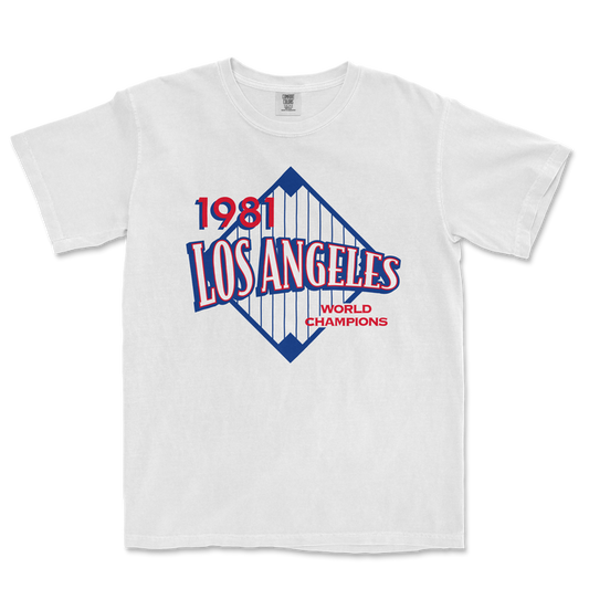 White Comfort Colors tee featuring a vintage Los Angeles 1981 World Champions graphic with red, blue, and white design elements.