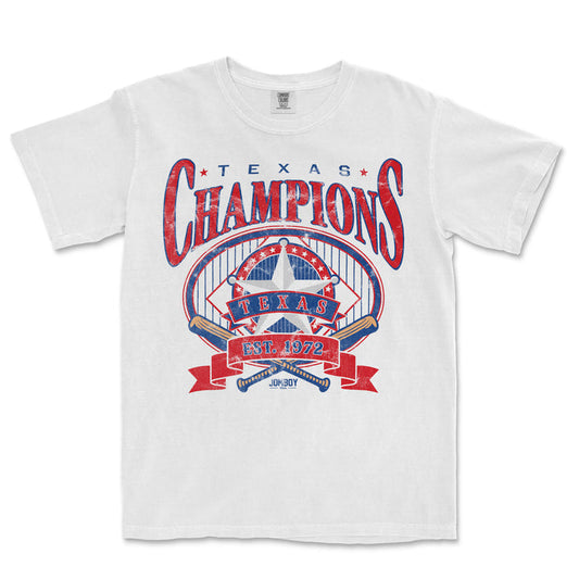 White Comfort Colors T-shirt featuring a vintage-style Texas Champions graphic with a star, banner, and baseball bats, celebrating 1972.