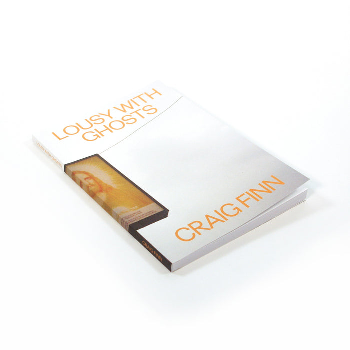 A limited edition book titled Lousy With Ghosts by Craig Finn is displayed on a white background, featuring a mostly white cover with orange text and a small rectangular image of a person near the spine. Brand: Craig Finn.