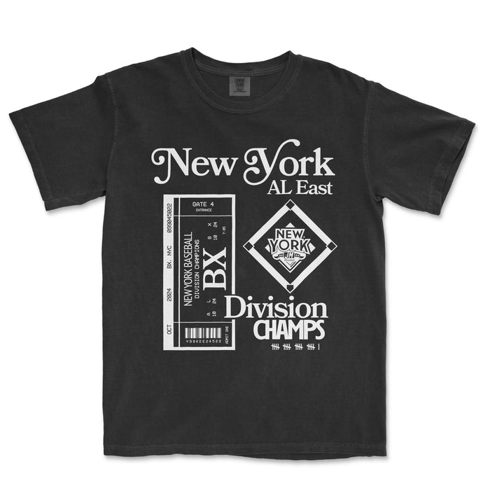 Black Comfort Colors T-shirt featuring white graphic design celebrating NYY Division Champions with baseball-themed elements and text.
