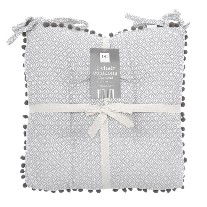 Pack of 2 chair cushions with grey and white diamond pattern and pom pom fringe