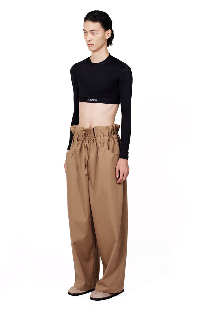 MANCANDY Palo Santo Pants in cotton ripstop gabardine with paper-bag waist and wide-leg silhouette.