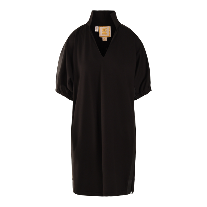 The Poppy Dress is a black Ponte, short-sleeved, knee-length dress with a loose fit, high collar, V-shaped neckline, gathered sleeve cuffs, and an inner collar label.