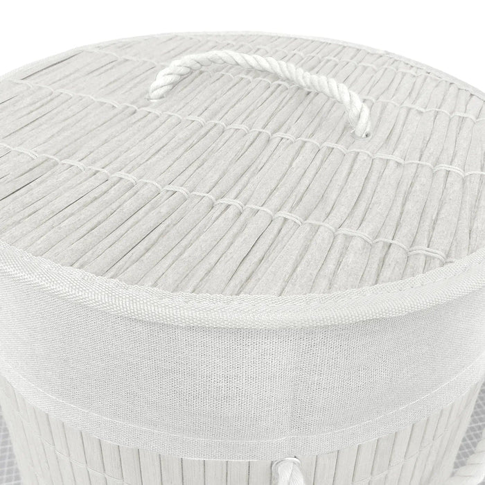 Details of rattan effect lid with white rope handle on a white bamboo laundry basket on