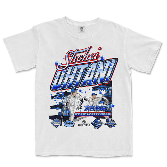 White T-shirt featuring a colorful graphic design of Shohei Ohtani, with images of him playing baseball, Japanese characters, and Los Angeles, CA text.