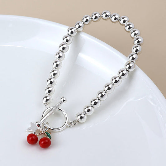 Silver Plated Beaded T-Bar Bracelet with Red Cherries and Star Charms