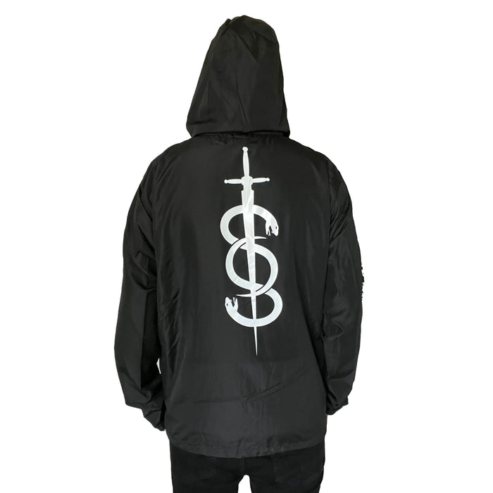 A person faces away from the camera against a white background, wearing a black Stay Sick Clothing zip-up jacket featuring a large white sword and snake graphic on the back.