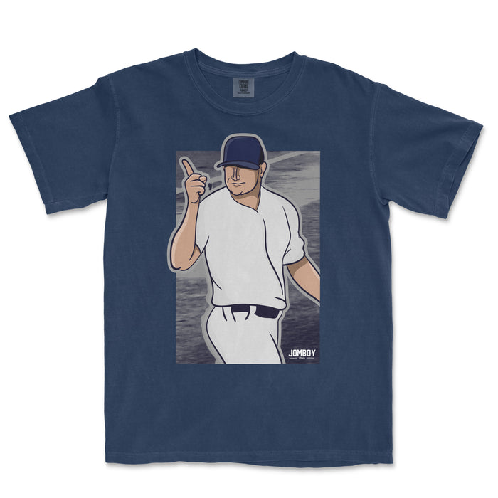 A navy T-shirt featuring a cartoon baseball player pointing with one finger, with a background of water and the text "JOMBOY".