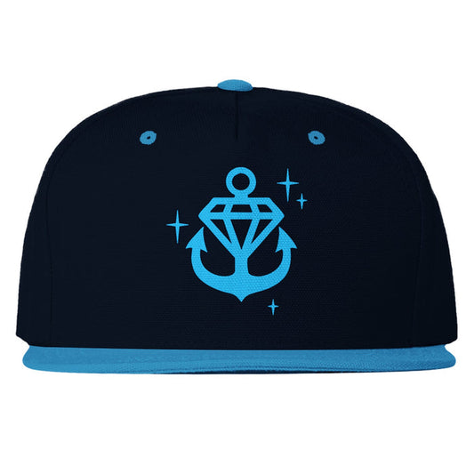 Stay Sick Clothing’s black snapback hat features a light blue brim, button, and eyelets, plus a sparkling light blue anchor logo with a diamond and stars on the front.
