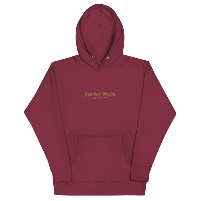 Maroon embroidered hoodie with "Jomboy Media, New York, NY" logo on the front, featuring a front pocket and drawstring hood.
