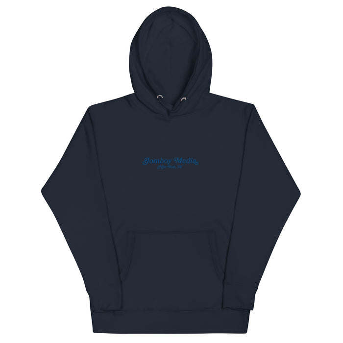 Navy blue embroidered hoodie with "Jomboy Media New York, NY" text on the front, featuring a front pocket and drawstring hood.