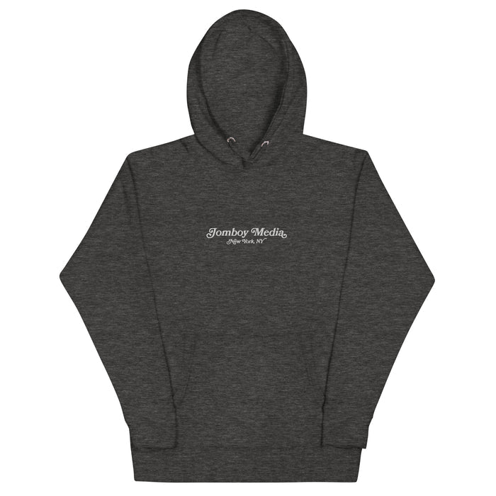 Dark gray embroidered hoodie with "Jomboy Media New York, NY" logo on the front, featuring a drawstring hood and long sleeves.