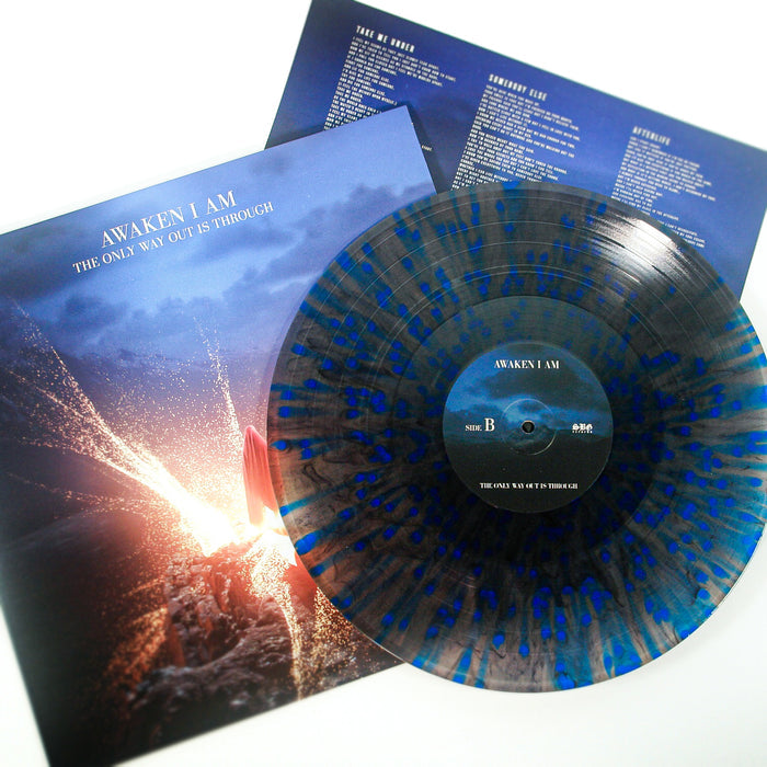 A grey with splatter vinyl LP of Awaken I Am’s The Only Way Out Is Through is displayed on its album cover, featuring a person reaching toward light. Includes an album insert and a full album digital download.