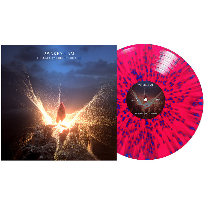 A vinyl LP with a pink, blue, and red splatter design beside its album cover—showing a glowing figure breaking through rocks. The album is Awaken I Am’s The Only Way Out Is Through.
