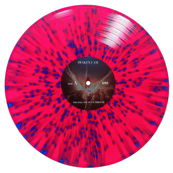 A vinyl record by Awaken I Am featuring a bright pink base with blue splatter radiating from the center and a black center label with white text—an eye-catching addition for collectors.