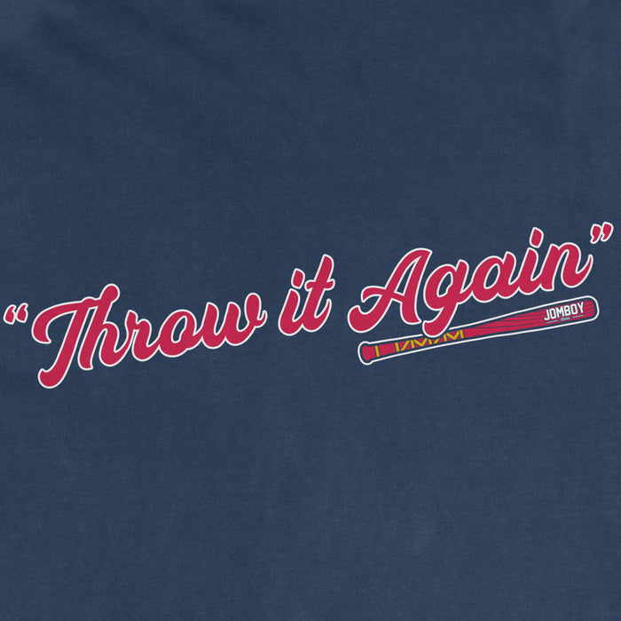 Close-up of a blue fabric with the phrase "Throw it Again" in red cursive text and a colorful baseball bat graphic.