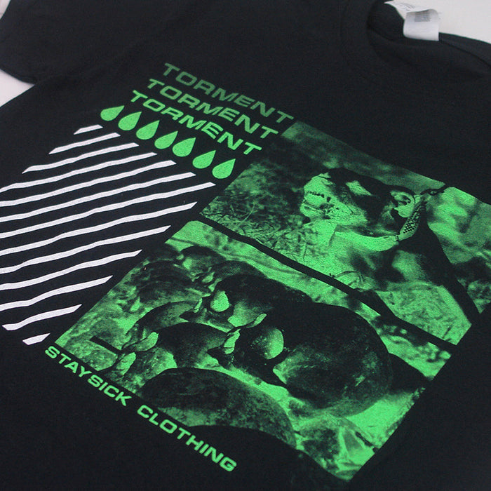 Stay Sick Clothing’s black Torment t-shirt features a green graphic of three lizards, wavy white lines, green teardrops, and bold TORMENT and STAY SICK CLOTHING text—ideal for fans of standout style.