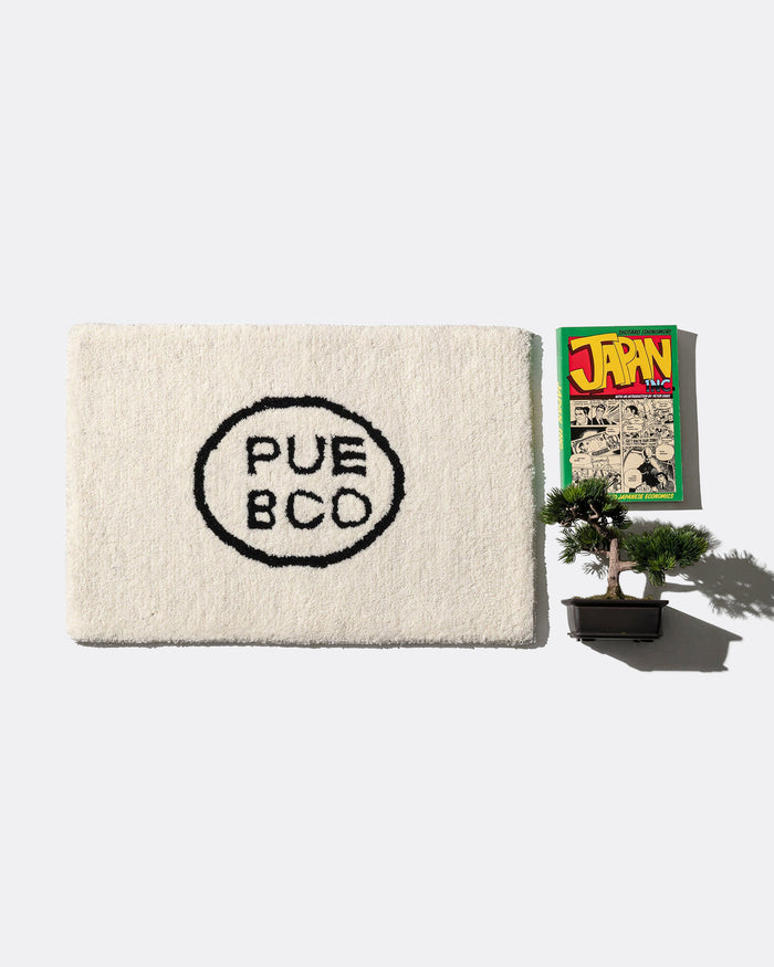 Tufted Mat - Puebco Logo