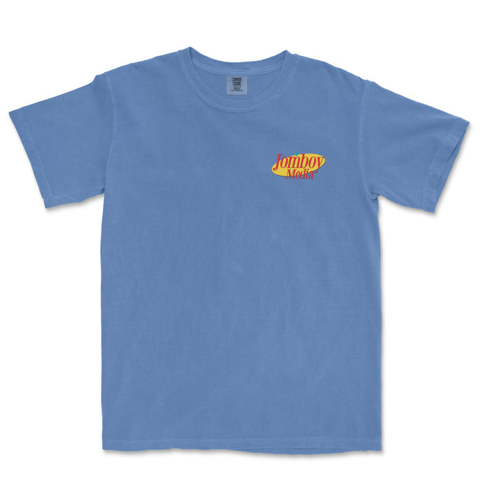 Blue T-shirt with "Jomboy Media" logo in red and yellow on the chest, short sleeves, and round neckline.