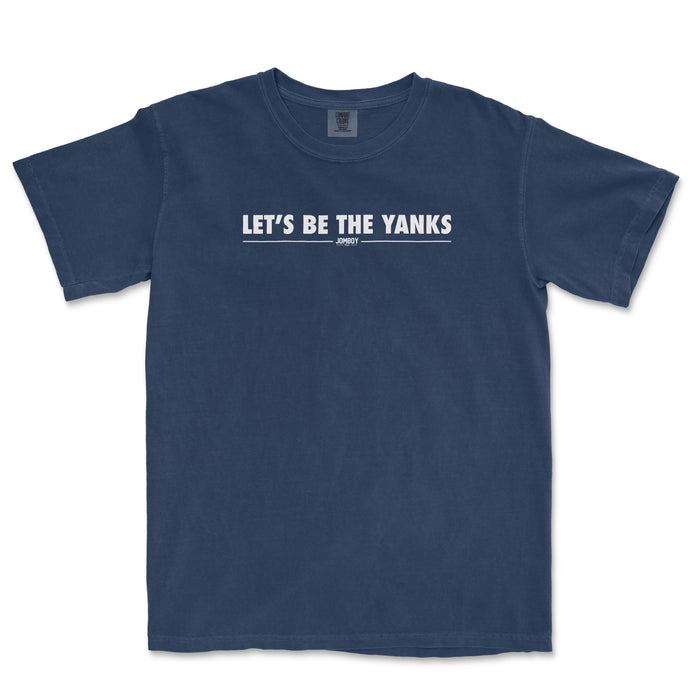 Blue T-shirt with white text that reads "LET'S BE THE YANKS" and "JOMBOY" underneath, casual style, front view.