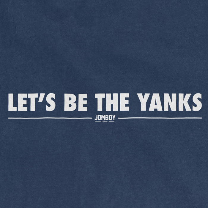 Close-up of a blue fabric with white text reading "LET'S BE THE YANKS" and a small "JOMBOY" logo below.